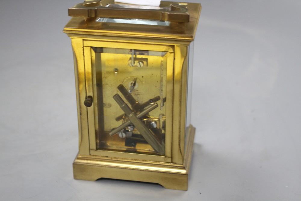 An Edwardian brass carriage timepiece with enamelled Roman dial, height 12.5cm